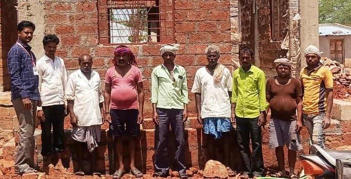 Karmik Mitras with construction workers at a Gram Panchayat field visit